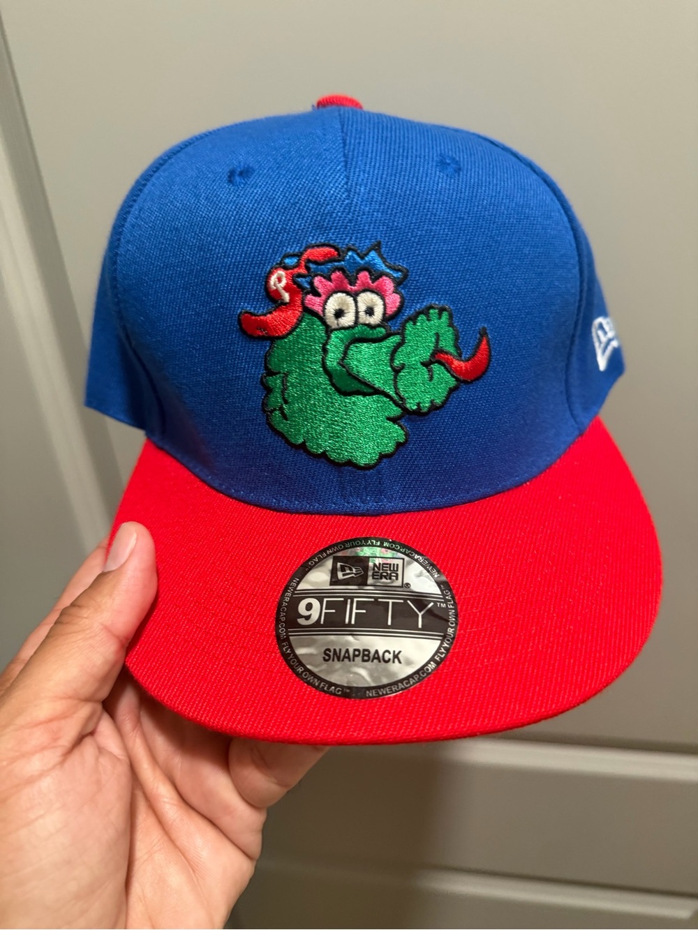 New Era Adult Snapback Hat - Blue Crown Red Brim with Green Mascot